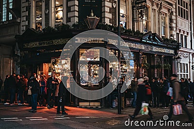 Facade of Red Lion pub in Shoreditch, London, UK, people in front, motion blur Editorial Stock Photo