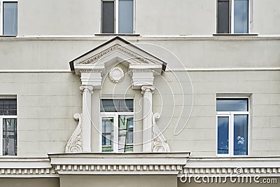 A facade of a residential building built in 1955 in the neoclassical style. Stock Photo