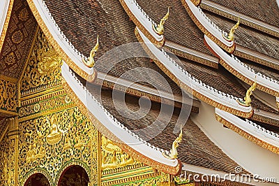 Facade and roof decoration of the Haw Pha Bang Buddhist temple at the Royal Palace Museum in Luang Prabang, Laos. Stock Photo