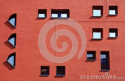 Red facade with windows, construction theme. Stock Photo