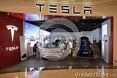 Facade Tesla store with many customers Editorial Stock Photo