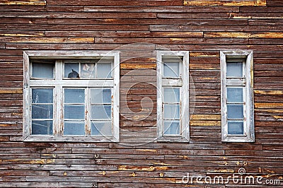 Facade of a tumbledown wooden house Stock Photo