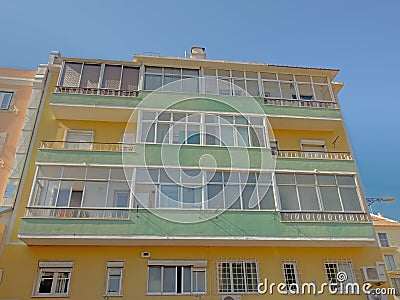 Facade of a typical apartment building in pastel colors in Lisbon, Portugal Editorial Stock Photo