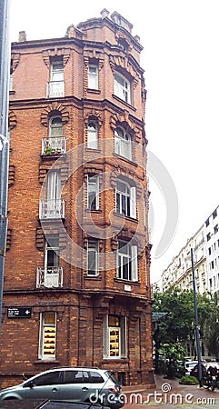 Facade view of a neoclassical brick building, in Republica Arabe and Cabello streets. Buenos Aires, Argentina Stock Photo