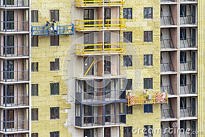 Facade work and insulation of a multistory building Editorial Stock Photo