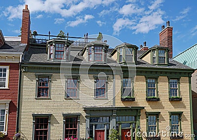 facades of colorful old clapboard houses Stock Photo