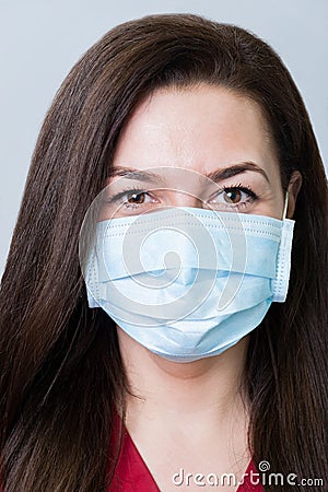 Face of a beautiful dentist woman wearing a mask Stock Photo