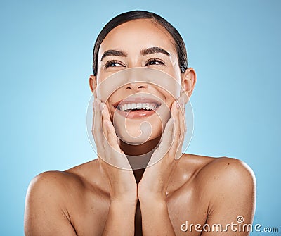 Face, beauty and skincare of woman in studio isolated on a blue background. Aesthetics, makeup and cosmetics of happy Stock Photo