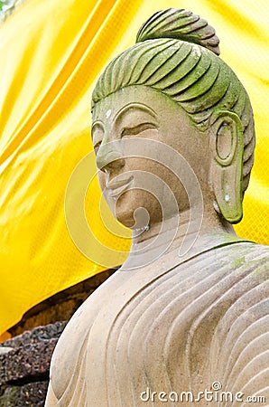 Face of brown buddha statue Stock Photo