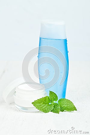 Face cream and lotion with urtica leaves Stock Photo
