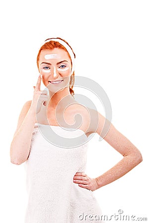 Face cream woman applying skin cream under eyes. Beauty eye Stock Photo