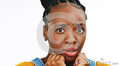 Face, fear and worried with a black woman in studio isolated on a white background looking afraid. Portrait, scared and Stock Photo