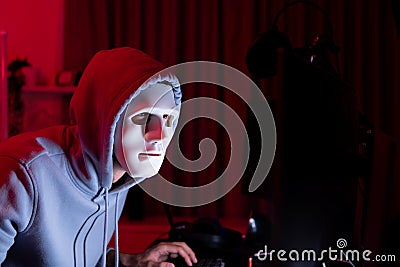 This is the face of a hacker who is knowledgeable with operating systems and other programs. He will exploit flaws and breach the Stock Photo