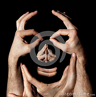 Face hands concept. Realty manipulation illusion. Black background Stock Photo