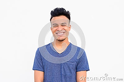 Face of happy young handsome multi ethnic man smiling against white background Stock Photo