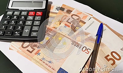 Face mask euro on paper money spread calculator and pen Stock Photo