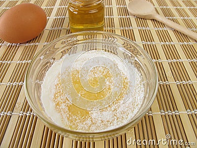 Face mask with honey, egg yolk and powdered milk Stock Photo
