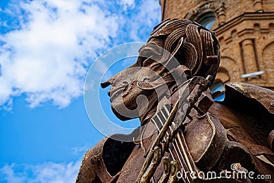 Face of an old rusty statue with iron violin Editorial Stock Photo