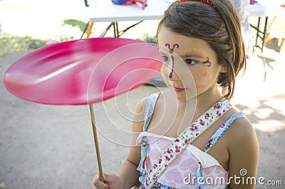 Child girl playing with spinning plate Stock Photo