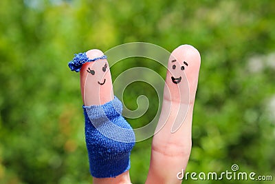 Face painted on fingers. Happy couple, the woman is pregnant Stock Photo