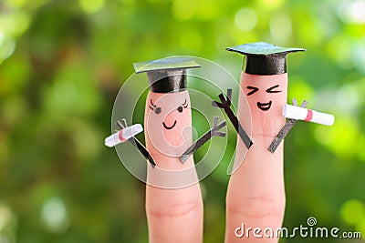 Face painted on the fingers. students holding their diploma after graduation Stock Photo