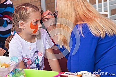 ZELENOGRADSK, KALININGRAD REGION, RUSSIA - SEPTEMBER 08, 2018: Face painting in time of open city festival. Editorial Stock Photo