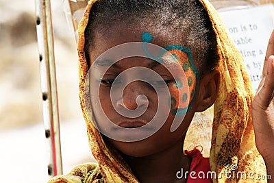Face painting to local kids in Zanzibar Editorial Stock Photo