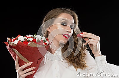 Face, red lips, strawberry, marshmallows, black background Stock Photo