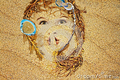 Face in the sand Stock Photo