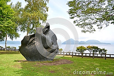 Face sculpture at Toya Lake, Japan Editorial Stock Photo