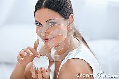 Face Skin Care. Beautiful Woman With Facial Cream. Cosmetics Stock Photo