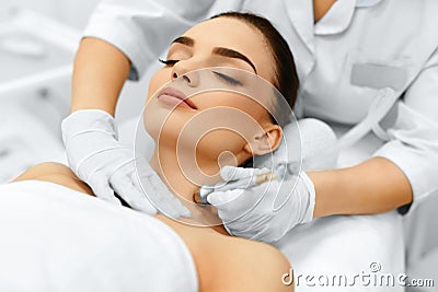 Face Skin Care. Diamond Microdermabrasion Peeling Treatment, Beauty Spa. Cosmetology. Stock Photo