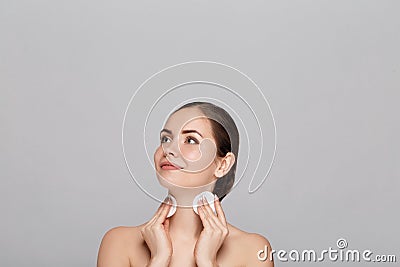 Face skin care. Woman applying facial cleanser on face closeup. Girl using cleansing cosmetic product Stock Photo
