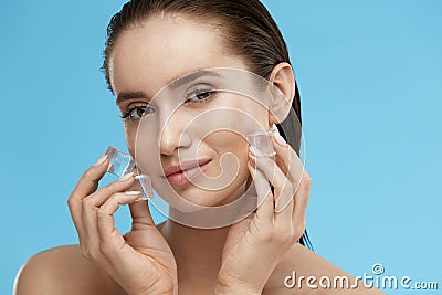 Face Skin Care. Woman Applying Ice Cubes Stock Photo