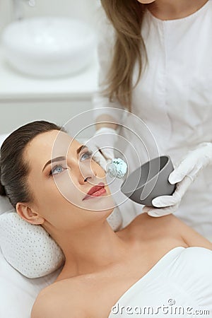 Face Skin Care. Woman Doing Alginate Facial Mask At Cosmetology Stock Photo