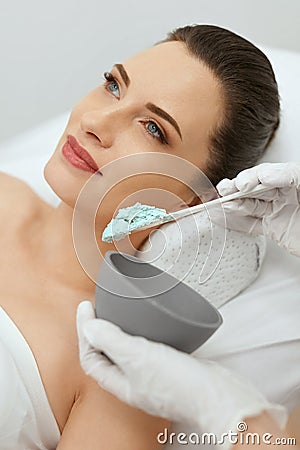 Face Skin Care. Woman Doing Alginate Facial Mask At Cosmetology Stock Photo