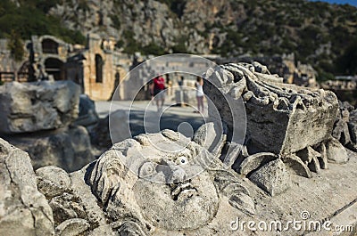 Face stone carving in ancient town of Myra in Lycia region, Antique culture archaelogical site, Ruins of ancient city Stock Photo