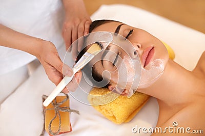 Face Treatment. Woman in Beauty Salon Gets Marine Mask Stock Photo