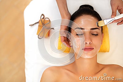 Face Treatment. Woman in Beauty Salon Gets Marine Mask Stock Photo