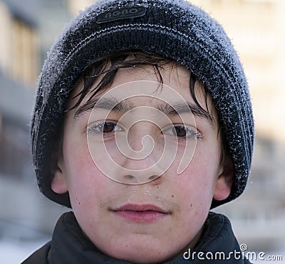 Face of young caucasian boy in winter walking cold weather siberian winter Stock Photo