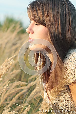 Face of young girl in lea Stock Photo