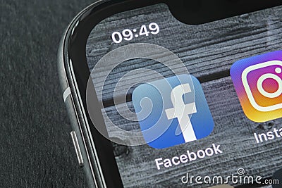 Facebook application icon on Apple iPhone X smartphone screen close-up. Facebook app icon. Social media icon. Social network Editorial Stock Photo