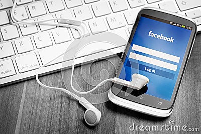Facebook application on smart phone screen. Editorial Stock Photo