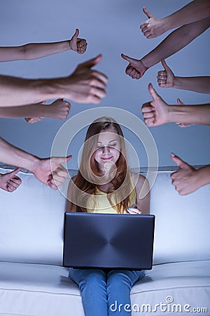 Facebook girl on couch Stock Photo