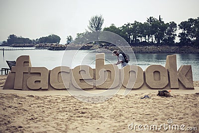 Facebook logo made of sand Editorial Stock Photo