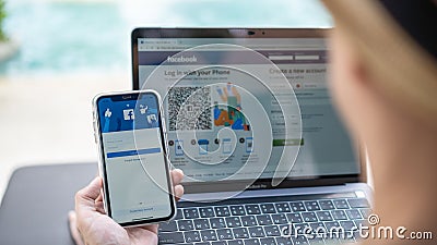 Facebook social media app icon signup page on iphone XR mobile smartphone device and computer laptop for user FB live public Editorial Stock Photo