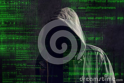 Faceless hooded anonymous computer hacker Stock Photo