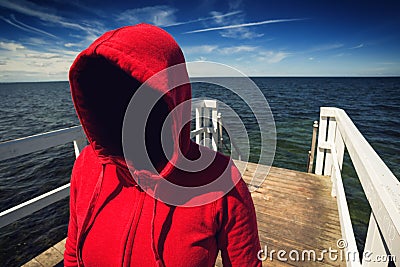 Faceless Hooded Unrecognizable Woman at Ocean Pier, Abduction Co Stock Photo
