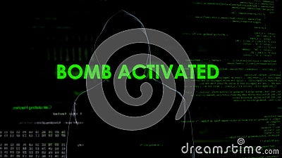 Faceless male hacker remotely activating bomb, terrorism, cyber crime concept Stock Photo