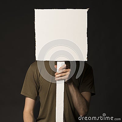 Faceless person holding a blank sign Stock Photo